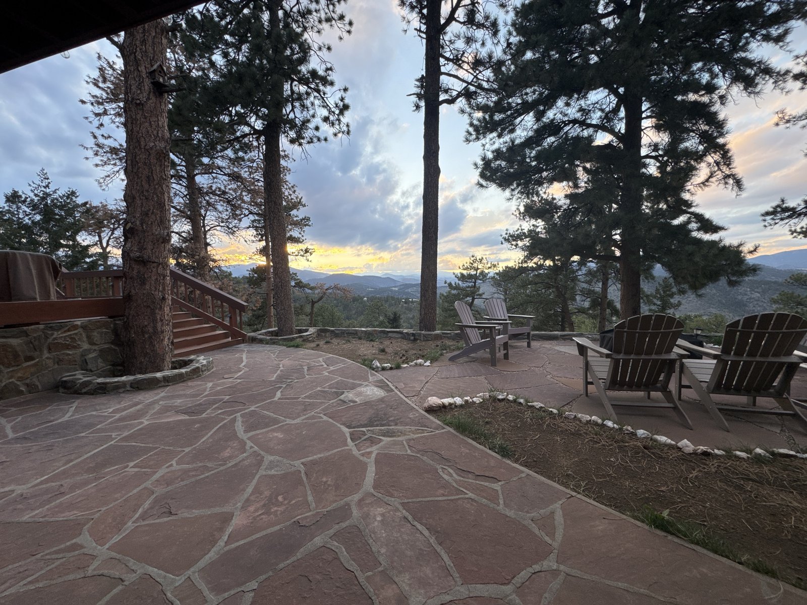 Flagstone patio with mountain view at sunset